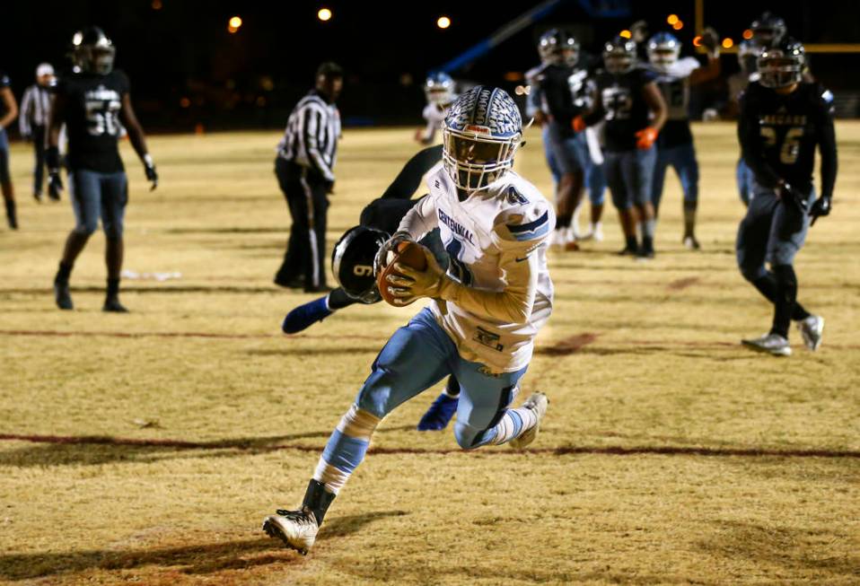 Centennial's Aaron Johnson (4) scores a touchdown against Desert Pines during the second half o ...