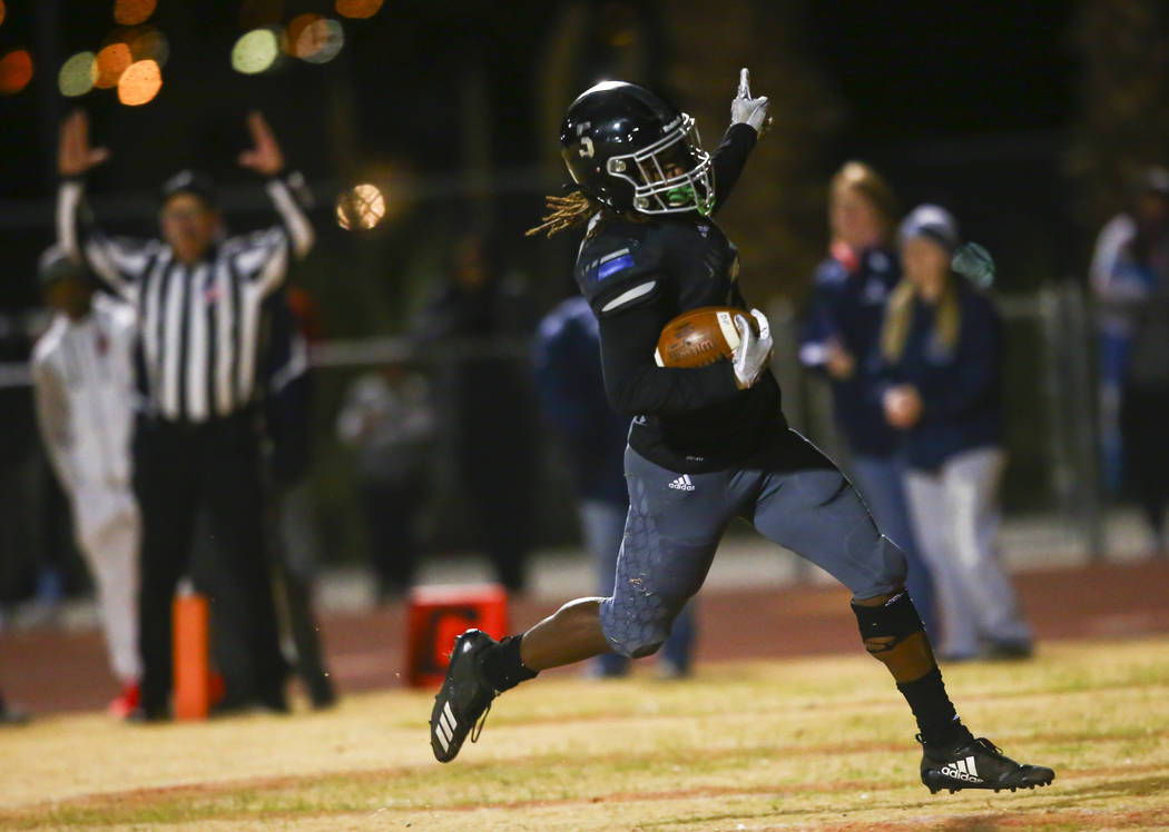 Desert Pines' Darius Stewart (5) scores a touchdown against Centennial during the second half o ...