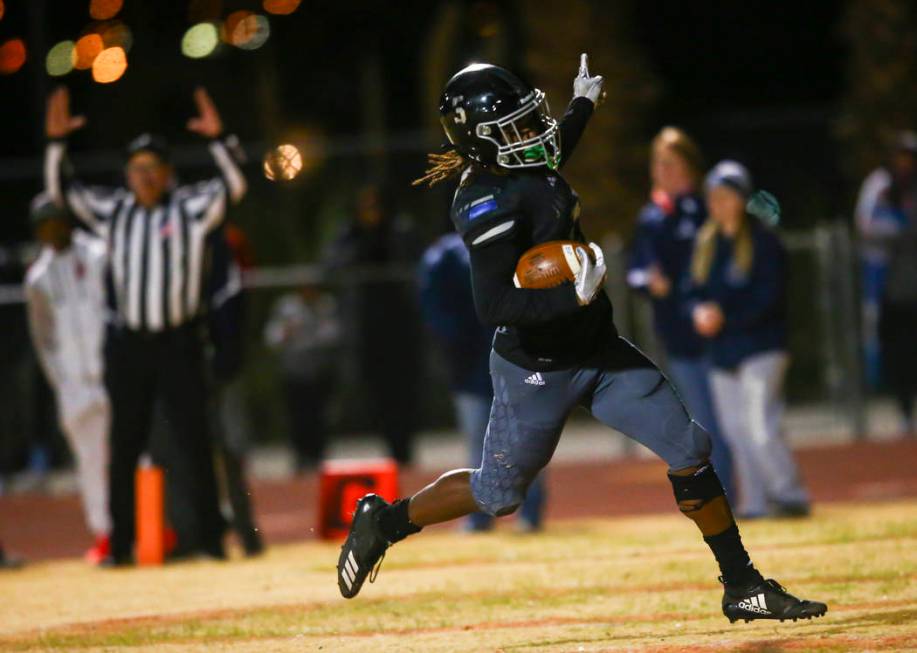 Desert Pines' Darius Stewart (5) scores a touchdown against Centennial during the second half o ...