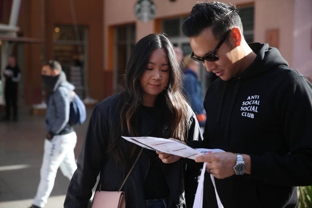 Jamie Lee, left, and her husband Gregory, of Los Angeles, shop at Las Vegas Premium Outlets Nor ...