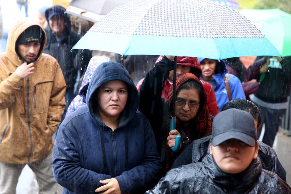 People line up to enter JCPenny at Meadows Mall in Las Vegas for early Black Friday deals on Th ...