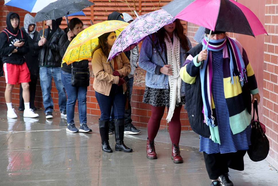 People line up to enter JCPenny at Meadows Mall in Las Vegas for early Black Friday deals on Th ...