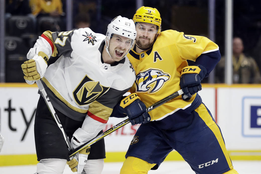 Nashville Predators left wing Filip Forsberg (9) battles against Vegas Golden Knights defensema ...