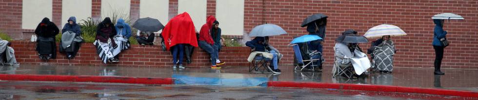 People line up to enter JCPenney at Meadows Mall in Las Vegas for early Black Friday deals on T ...