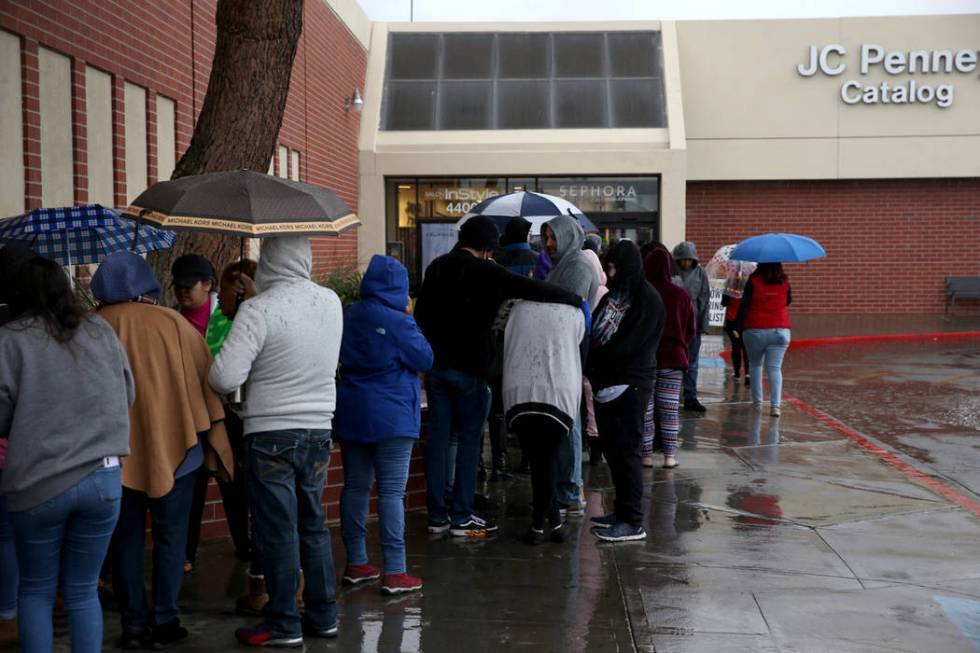 People line up to enter JCPenney at Meadows Mall in Las Vegas for early Black Friday deals on T ...