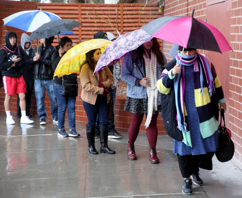 People line up to enter JCPenney at Meadows Mall in Las Vegas for early Black Friday deals on T ...