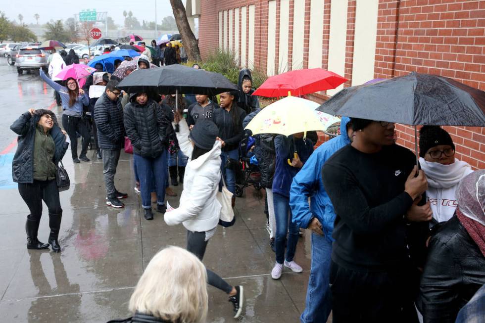 People line up to enter JCPenney at Meadows Mall in Las Vegas for early Black Friday deals on T ...