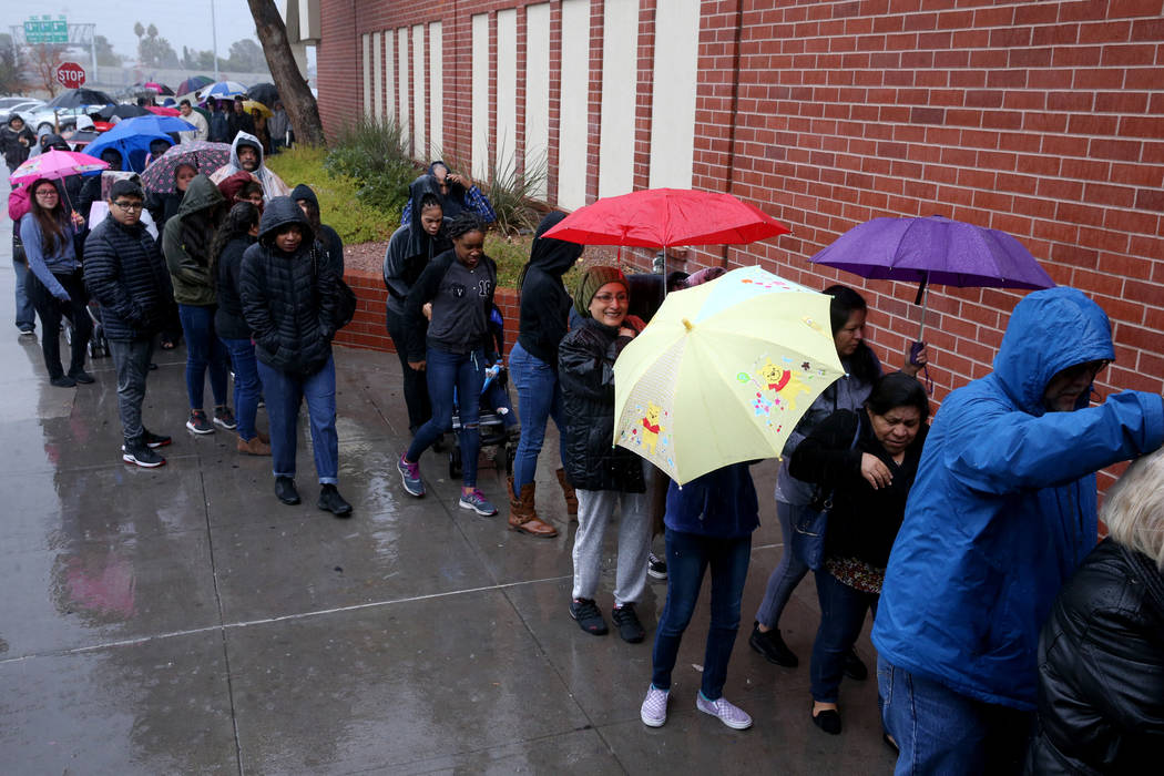 People line up to enter JCPenney at Meadows Mall in Las Vegas for early Black Friday deals on T ...