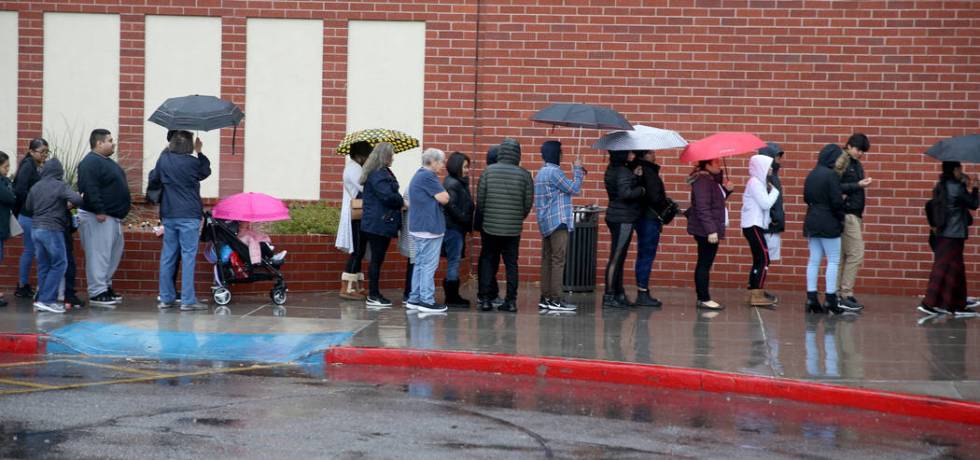 People line up to enter JCPenny at Meadows Mall in Las Vegas for early Black Friday deals on Th ...