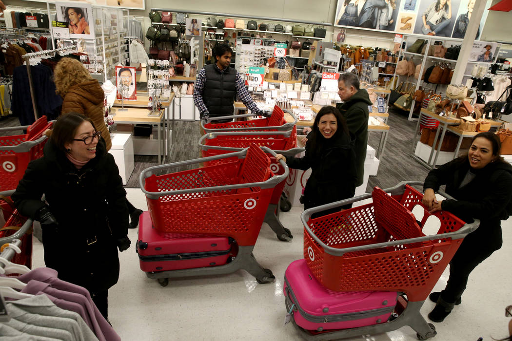 Shoppers from left, Cristina Deschamps, Ivonne Galindo and Eloisa Deschamps, of Mexico City, lo ...