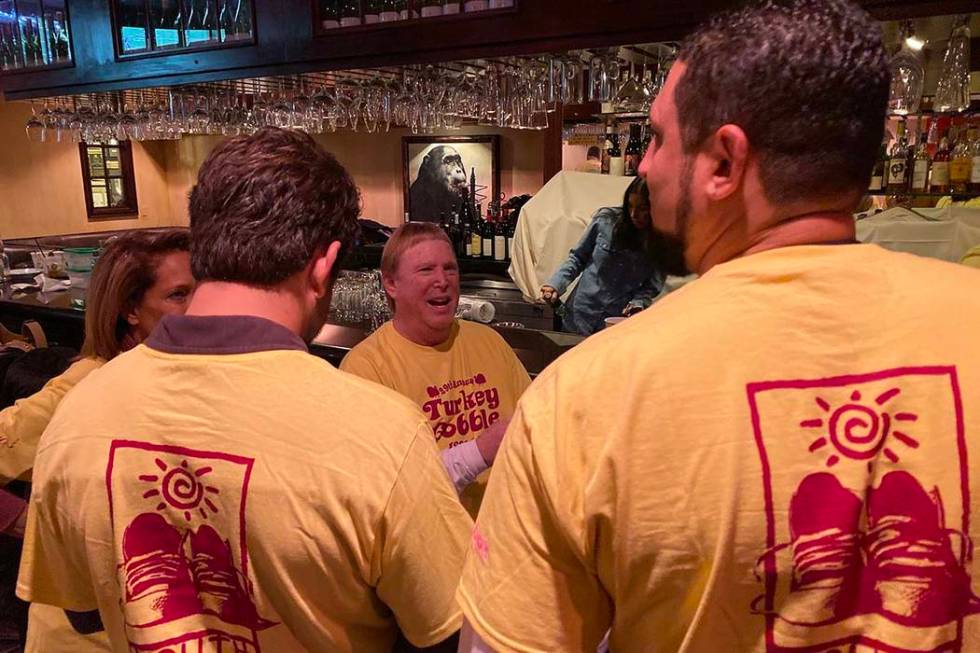 Raiders owner Mark Davis is shown with volunteers at Piero's Italian Restaurant during a Youth ...