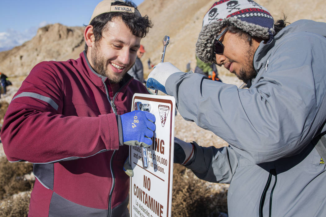 Volunteers for Get Outdoors Nevada Dillon Battaglia, left, of Las Vegas, and Carlos Ojito-Palma ...