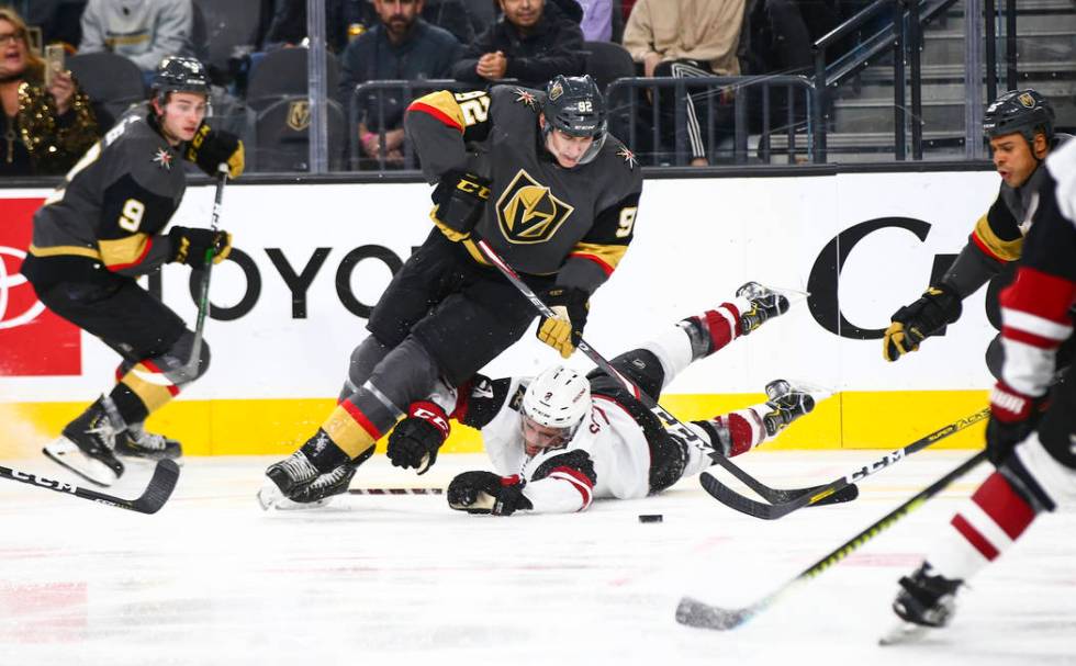 Golden Knights' Tomas Nosek (92) skates past Arizona Coyotes' Nick Schmaltz (8) during the thir ...