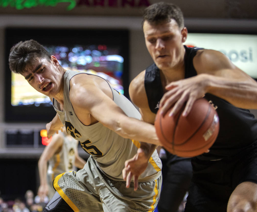 University of Iowa's center Luka Garza steals the ball from San Diego State University's forwar ...