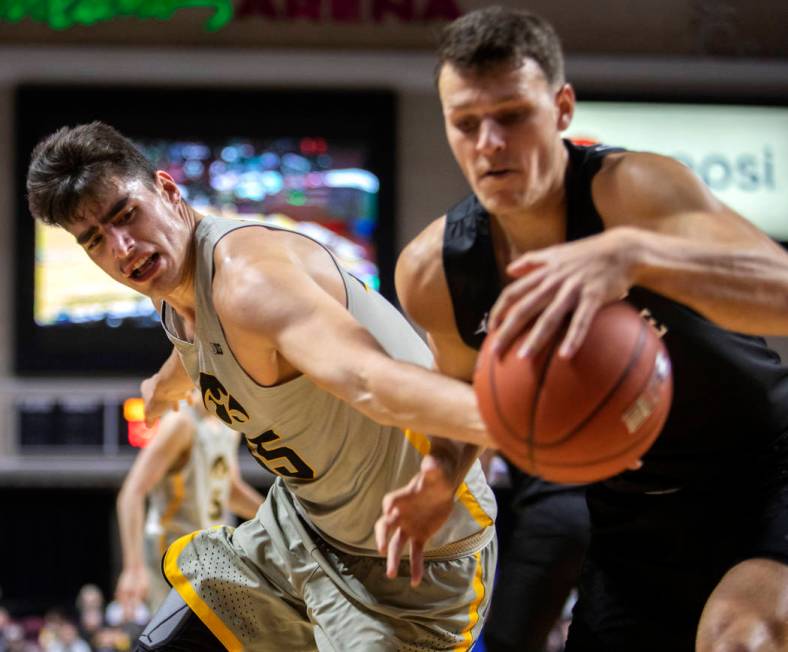 University of Iowa's center Luka Garza steals the ball from San Diego State University's forwar ...