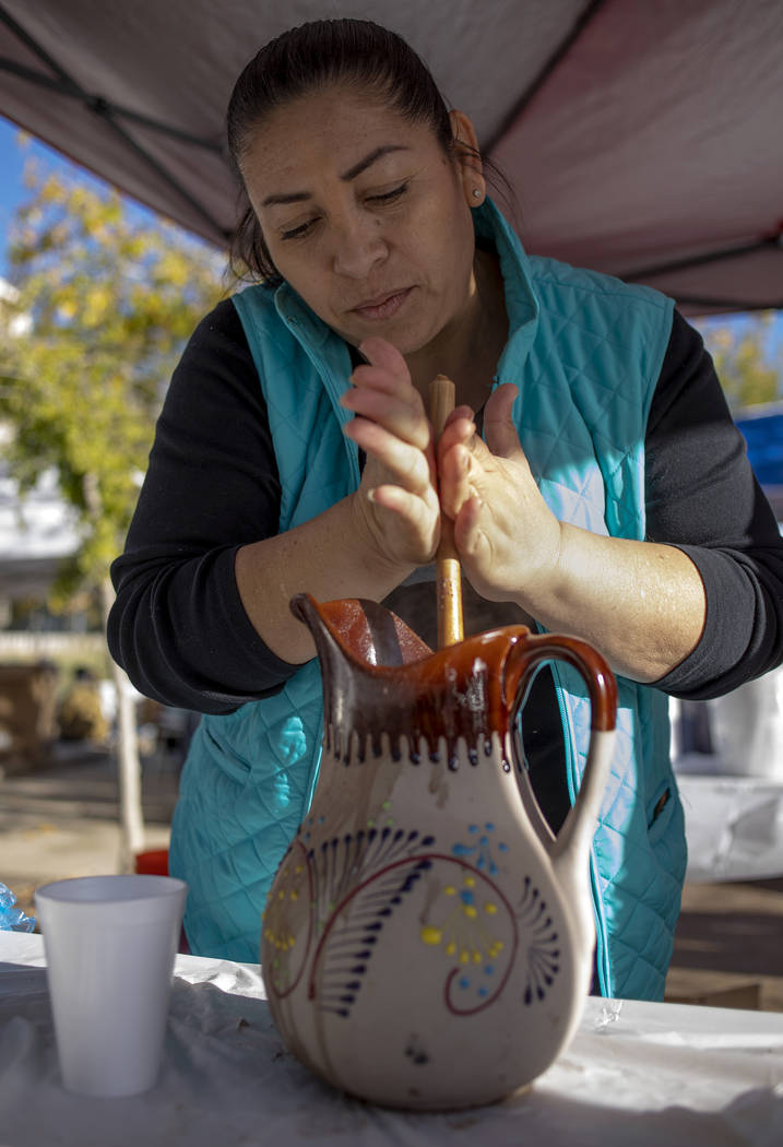 Deyla Sanchez, owner of Deylicias Oaxaque–as, makes Mexican hot chocolate at the Las Veg ...