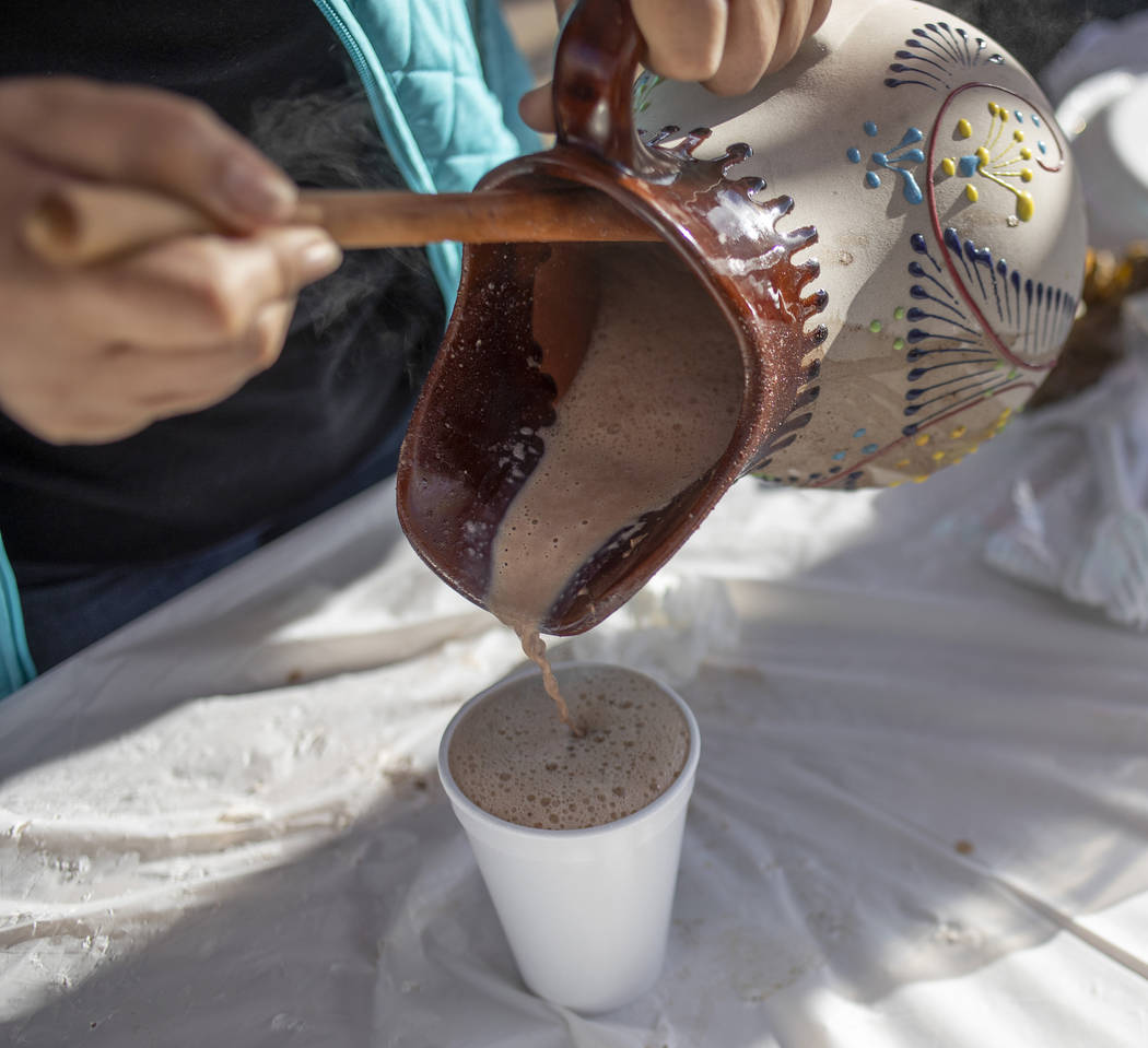 Mexican hot chocolate from Deylicias Oaxaqe–as is poured by the company's owner, Deyla S ...