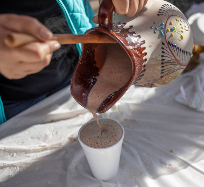 Mexican hot chocolate from Deylicias Oaxaqe–as is poured by the company's owner, Deyla S ...