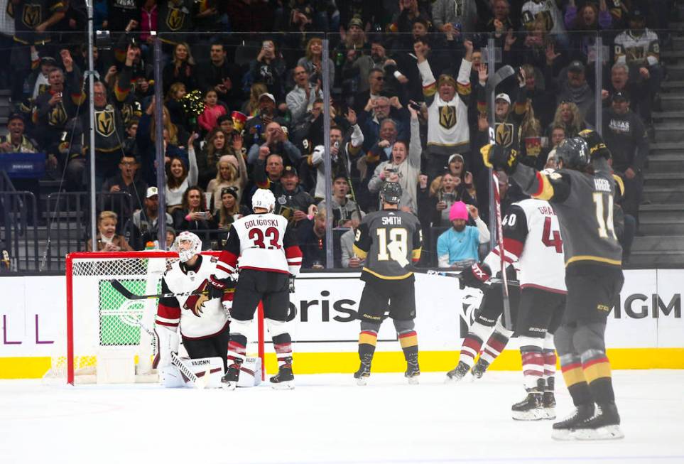 Golden Knights' Nicolas Hague (14), far right, celebrates a goal by Alex Tuch (89) against Ariz ...