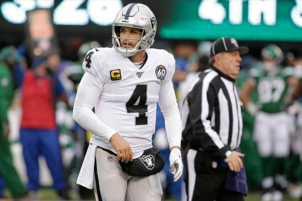 Oakland Raiders quarterback Derek Carr reacts during the second half of an NFL football game ag ...