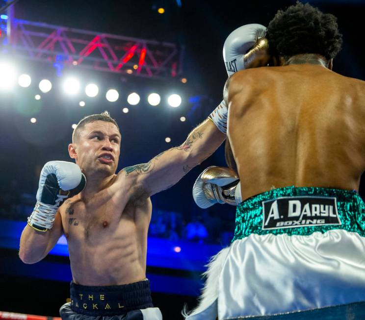 Carl Frampton, left, connects on the face of Tyler McCreary during round 1 of their WBC super f ...