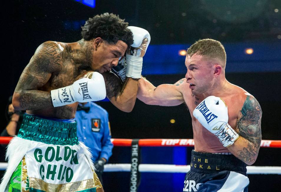 Tyler McCreary, left, takes a punch to the chin from Carl Frampton during round 6 of their WBC ...