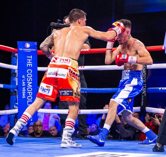 Oscar Valdez, left, sends the final punch to the head of Adam Lopez during round 7 of their WBC ...