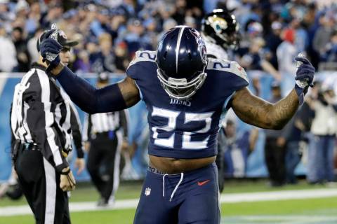 Tennessee Titans running back Derrick Henry celebrates after scoring a touchdown on a 74-yard r ...