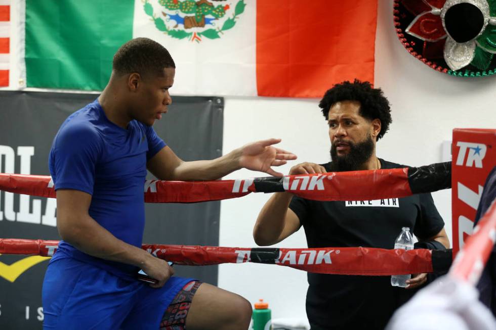 Boxer Devin Haney, left, with his father and trainer William "Bill" Haney, talk to each other a ...