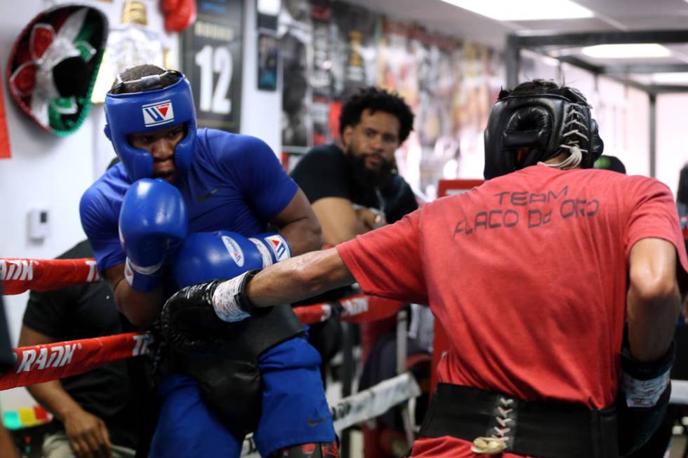 Boxer Devin Haney, left, defends a punch against Cesar Valenzuela while sparring in preparation ...