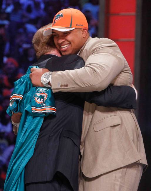 Florida offensive lineman Mike Pouncey hugs NFL commissioner Roger Goodell after he was selecte ...