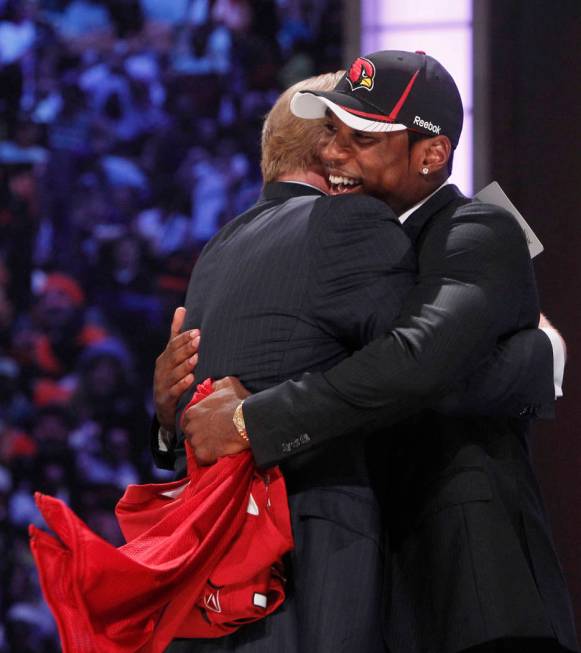 LSU cornerback Patrick Peterson, right, hugs NFL commissioner Roger Goodell after he was select ...