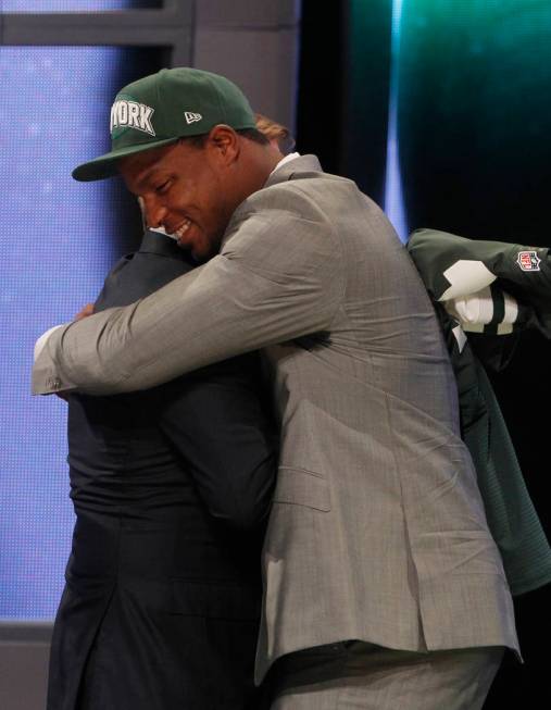 North Carolina defensive end Quinton Coples, right, hugs NFL Commissioner Roger Goodell after b ...