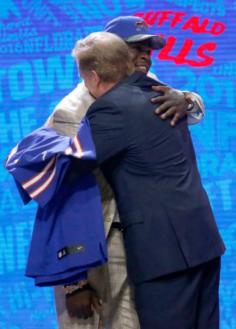 Clemsons Shaq Lawson embraces with NFL commissioner Roger Goodell after being selected by the B ...