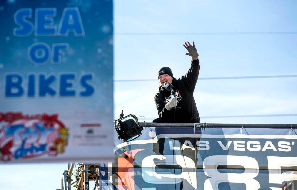 Chet Buchanan, host at 98.5 KLUC, waves to supports while broadcasting live during the 18th Ann ...