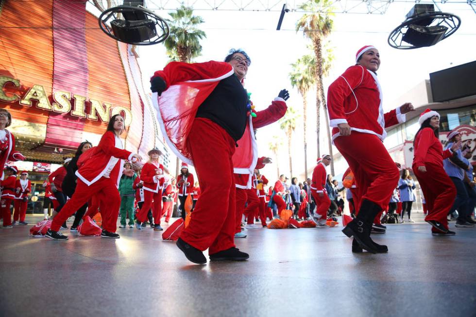 Marta Thomas, left, and Miriam Chavez, both of Las Vegas, dance to Zumba before the 14th annual ...