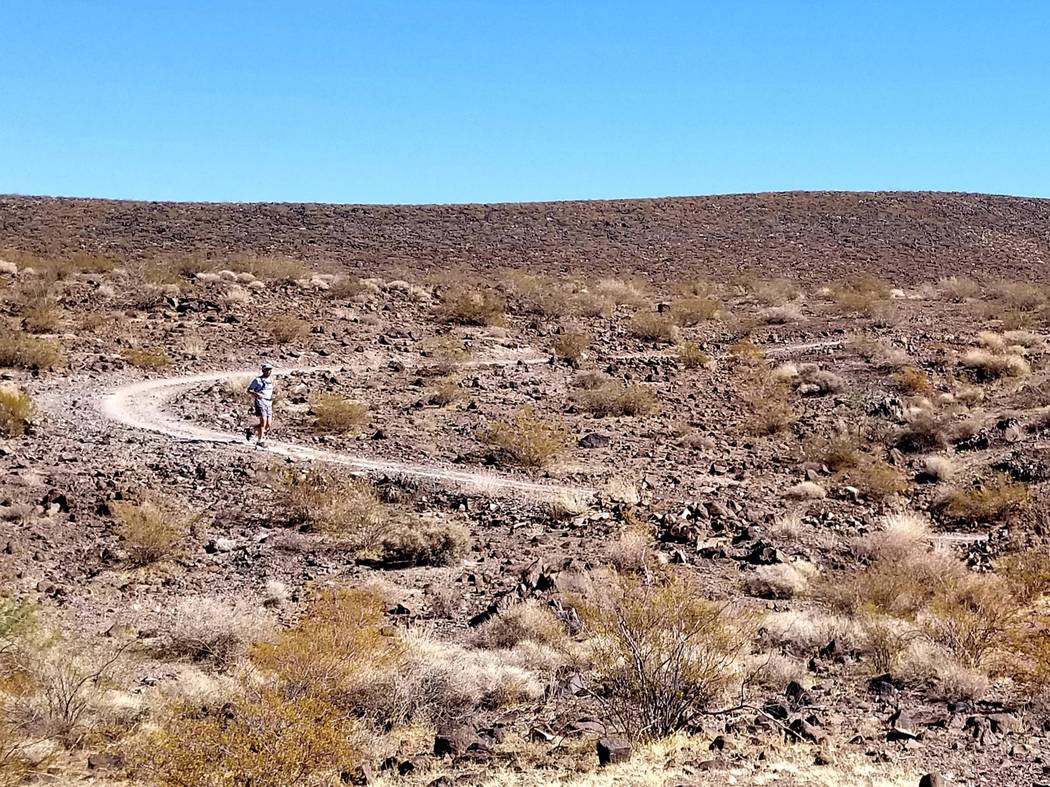 Runners find solitude and little traffic in the outback of Sloan Canyon National Conservation A ...