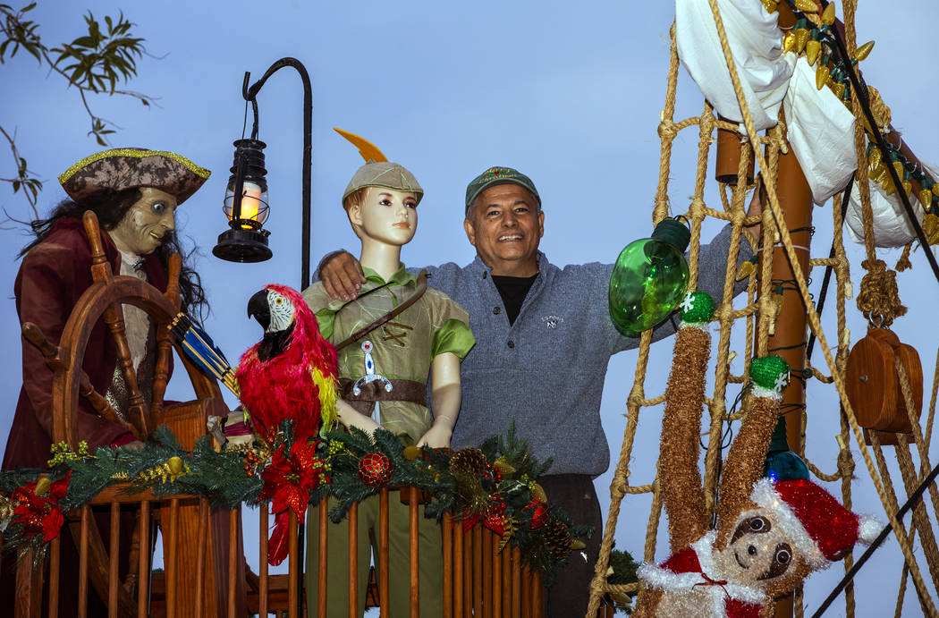 Juan Torres stands atop the pirate ship he built for his wife Maria Acosta as part of a holiday ...