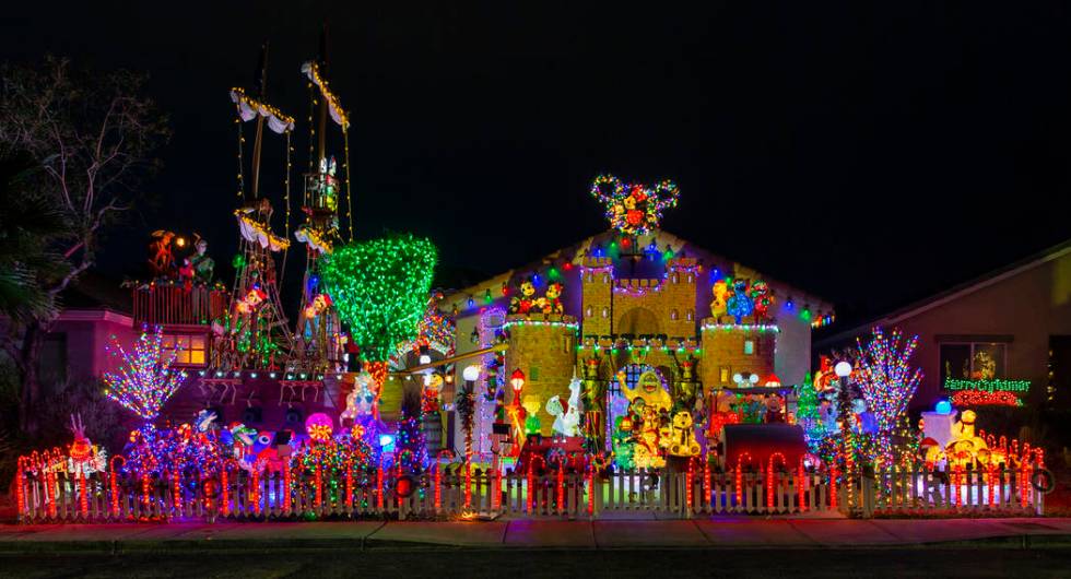 Thousands of holiday lights in the yard of Maria Acosta and Juan Torres which will be featured ...