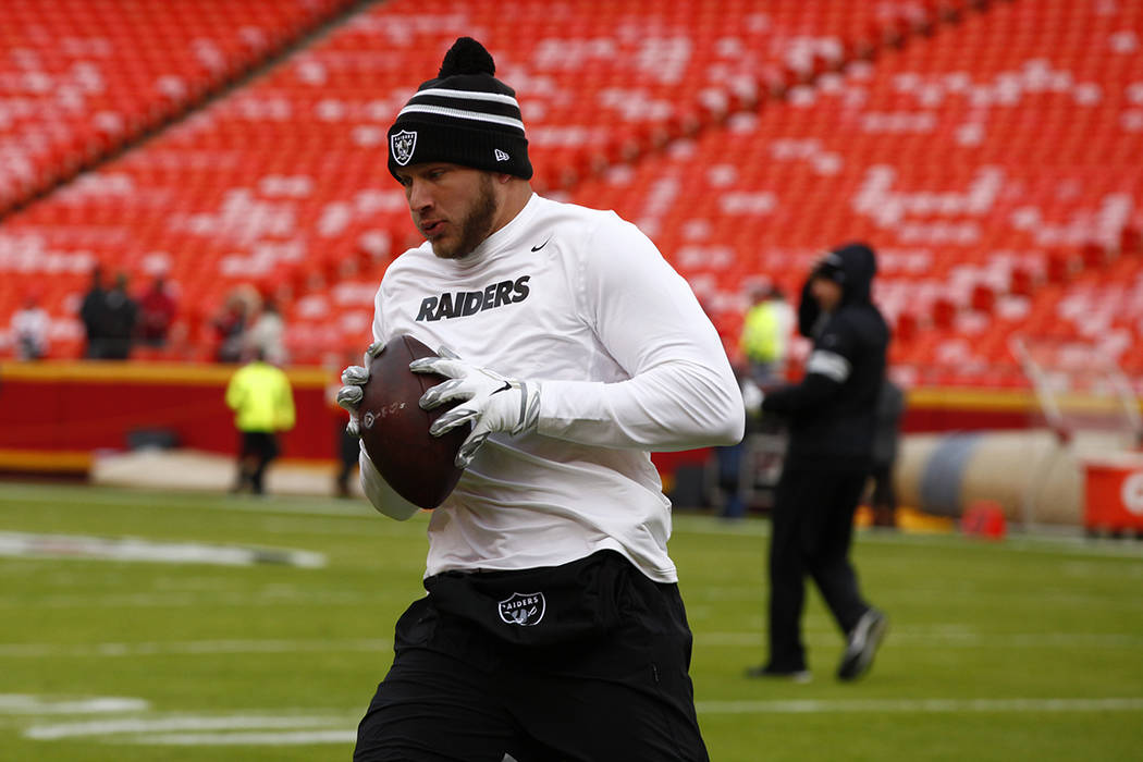 Oakland Raiders tight end Foster Moreau catches the football during pregame warmups before an N ...