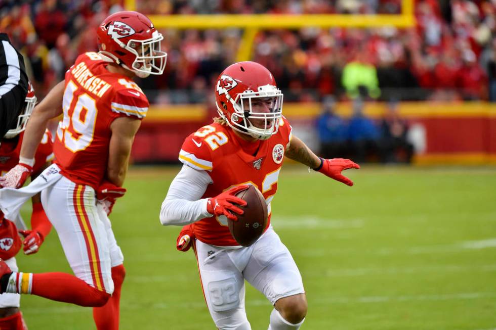 Kansas City Chiefs safety Tyrann Mathieu (32) carries the ball after an interception against th ...