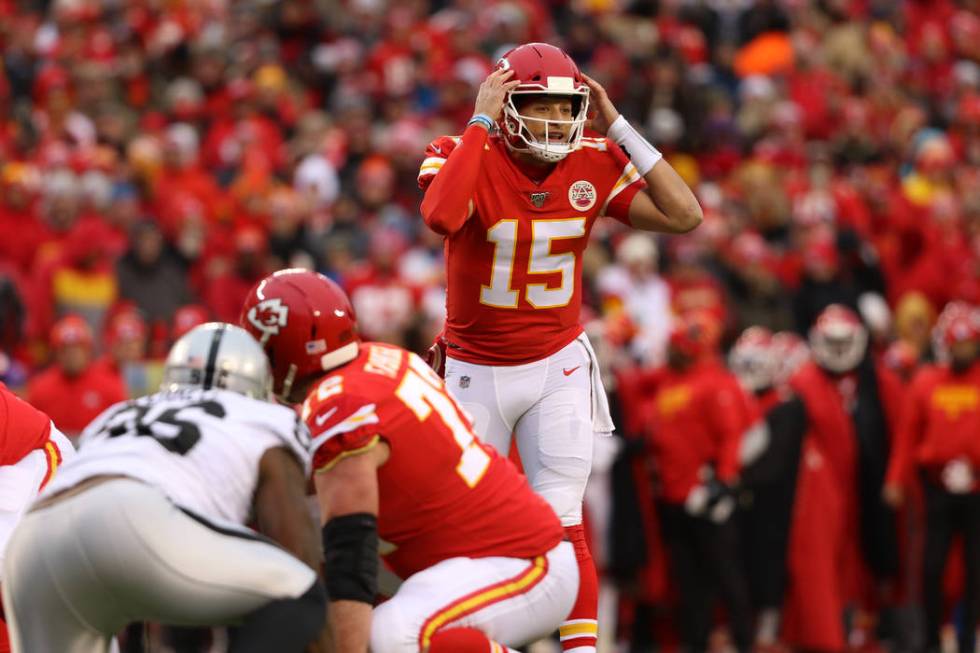 Kansas City Chiefs quarterback Patrick Mahomes (15) calls a play at the line of scrimmage durin ...