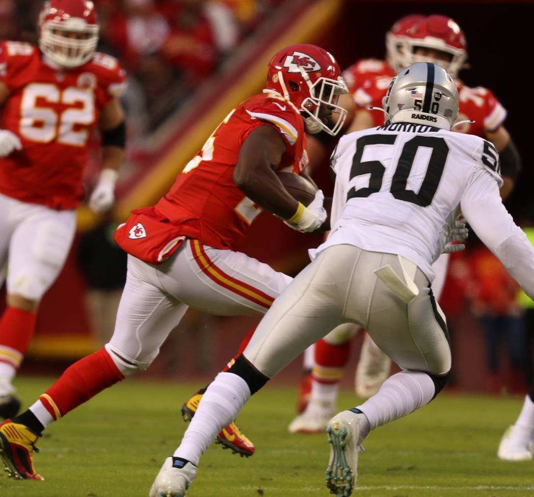 Kansas City Chiefs running back LeSean McCoy (25) rushes with the football as Oakland Raiders l ...
