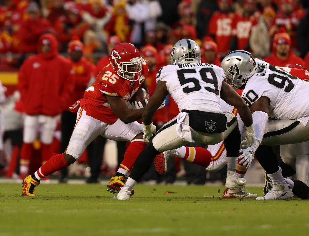 Kansas City Chiefs running back LeSean McCoy (25) rushes with the football as Oakland Raiders o ...