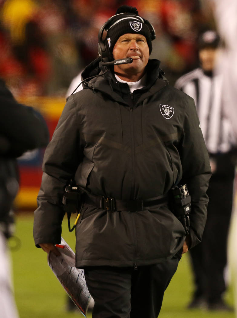 Oakland Raiders head coach Jon Gruden walks the sideline during the second half of an NFL game ...