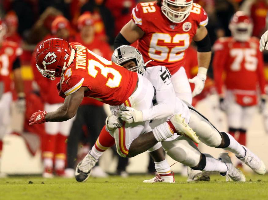 Oakland Raiders linebacker Nicholas Morrow (50) tackles Kansas City Chiefs running back Darwin ...