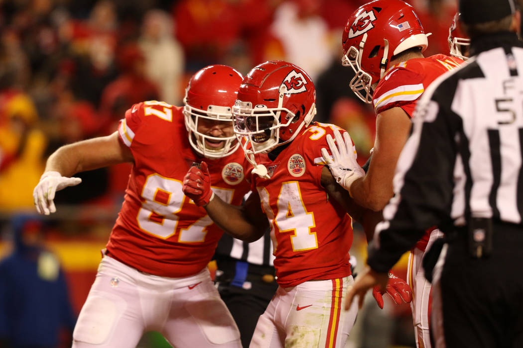 Kansas City Chiefs running back Darwin Thompson (34) celebrates his touchdown with tight end Tr ...