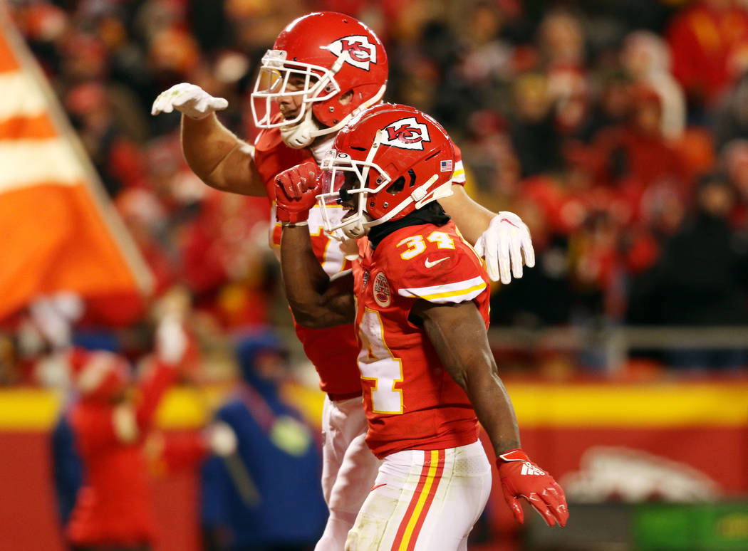 Kansas City Chiefs running back Darwin Thompson (34) celebrates his touchdown with tight end Tr ...