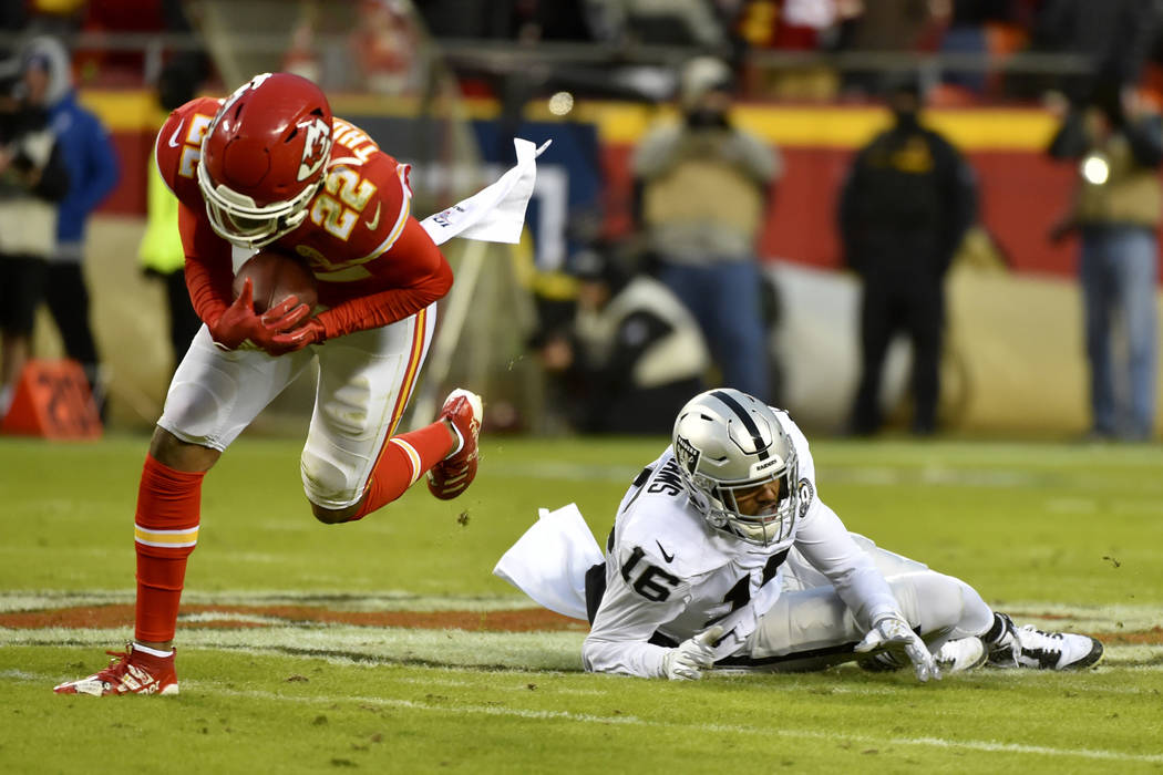 Kansas City Chiefs safety Juan Thornhill (22) intercepts a pass intended for Oakland Raiders wi ...