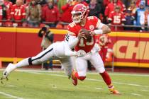 Kansas City Chiefs quarterback Patrick Mahomes (15) sheds a tackle by Oakland Raiders defensive ...